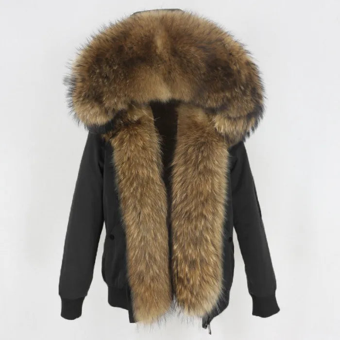 Womens fox fur parka with oversized hood in black with brown fur, emphasizing luxe texture and cozy winter comfort for cold days