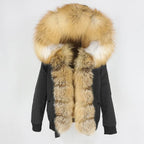 Womens fox fur parka with oversized hood in black with golden trim, offering rich contrast and plush warmth for winter dressing