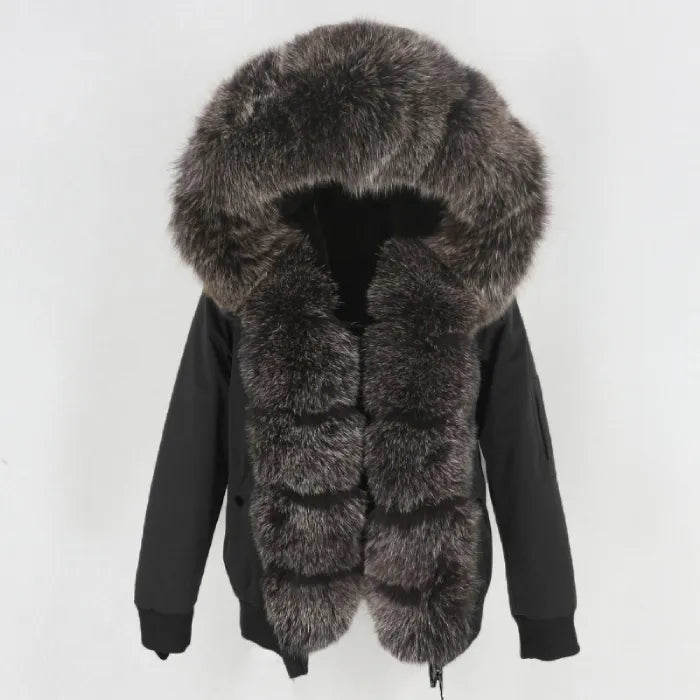 Womens fox fur parka with oversized hood in black with dark silver trim, offering plush texture and premium winter warmth