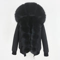 Womens fox fur parka with oversized hood in deep black, showcasing rich fluffy trim and elegant winter design for cozy comfort
