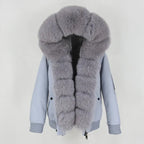 Womens fox fur parka with oversized hood in soft grey, featuring plush thick trim and luxury winter styling for added warmth