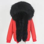 Womens fox fur parka with oversized hood in bold red with black trim, offering dramatic contrast and premium warmth for winter