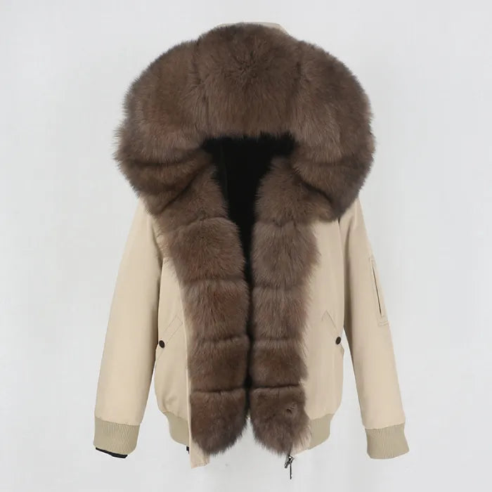 Womens fox fur parka with oversized hood in taupe with chocolate brown trim, adding rich warmth and elegant winter styling