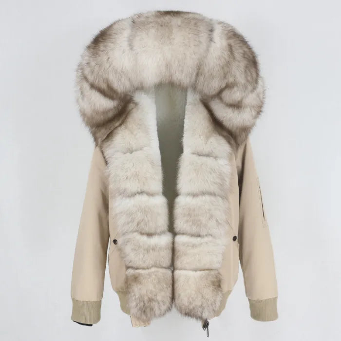 Womens fox fur parka with oversized hood in taupe featuring soft light trim, blending elegant neutrals with plush winter warmth