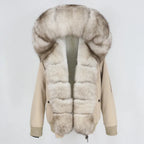 Womens fox fur parka with oversized hood in taupe featuring soft light trim, blending elegant neutrals with plush winter warmth