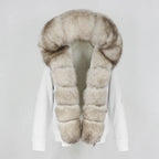Womens fox fur parka with oversized hood in white with pale beige trim, showcasing soft luxe texture and warm seasonal comfort