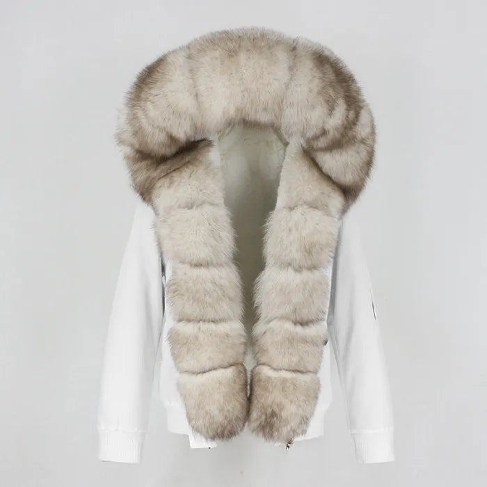 Womens fox fur parka with oversized hood in white with pale beige trim, showcasing soft luxe texture and warm seasonal comfort