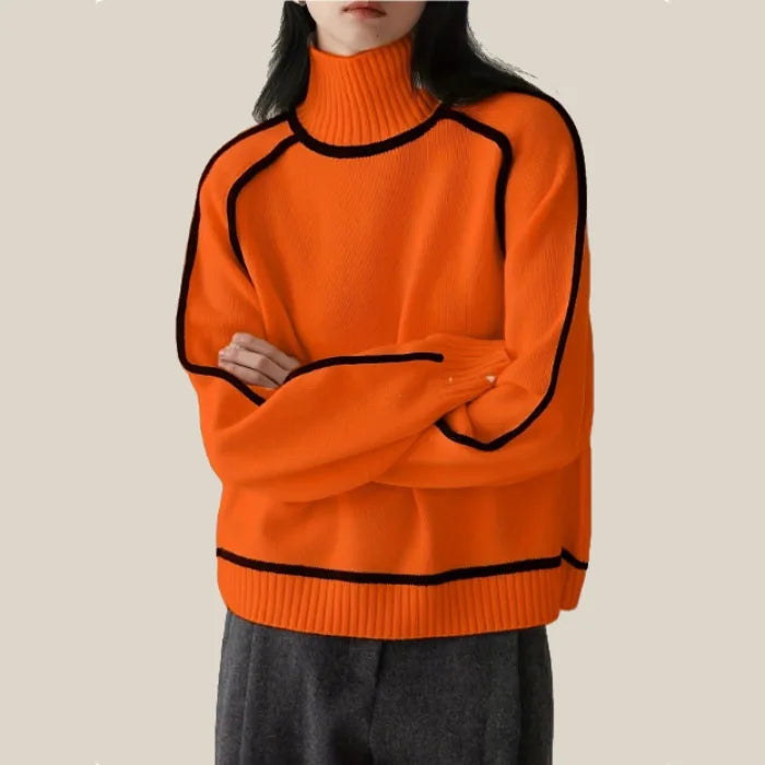 Bright orange Women's Half Turtleneck Sweater with bold black piping and ribbed neck and hem.