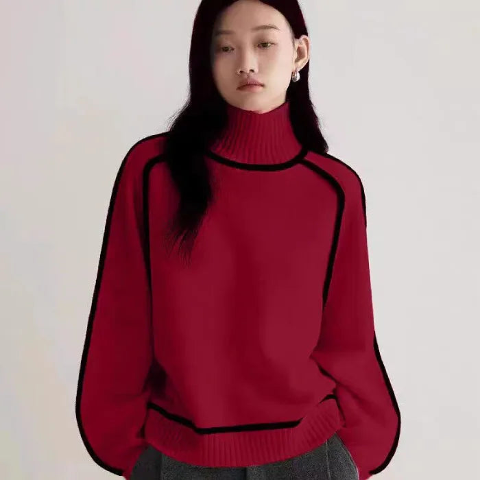 Women's Half Turtleneck Sweater in bold red with black piping details and ribbed cuffs and hem.