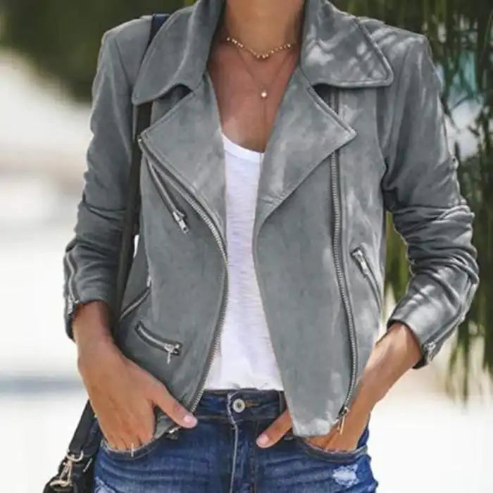 womens lapel grey suede moto jacket paired with white top and jeans outdoors.