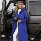 Women’s long hooded cardigan coat in striking blue styled by SUV, warm knit sleeves delivering bold comfort ideal for elevated streetwear