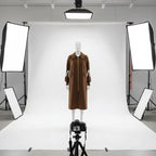 Women’s long hooded cardigan coat in white showcased in studio lighting, cozy knit texture offering chic warm style for winter outfits