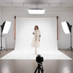 Women’s long hooded cardigan coat in white showcased in studio lighting, cozy knit texture offering chic warm style for winter outfits