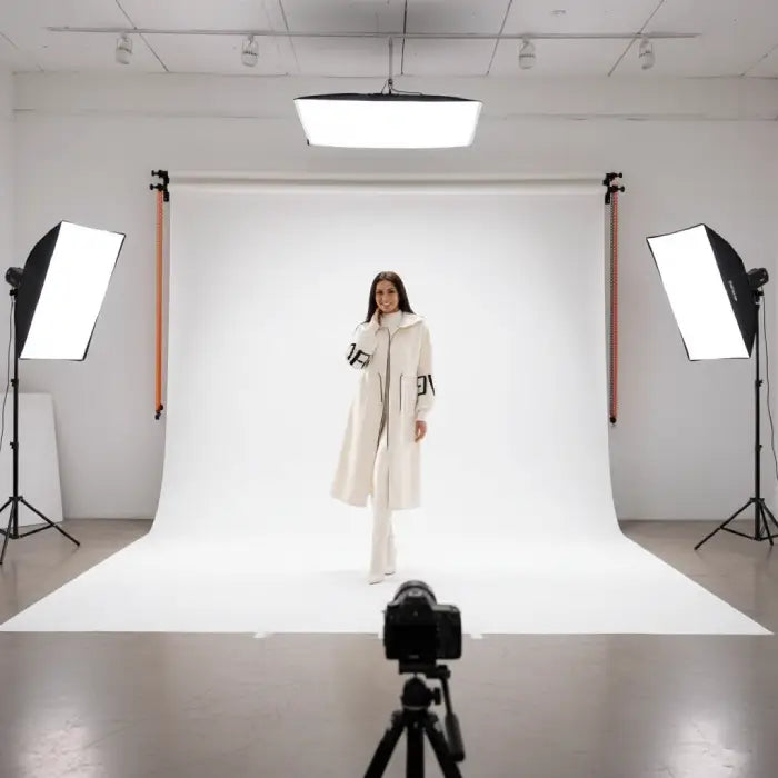 Women’s long hooded cardigan coat in white showcased in studio lighting, cozy knit texture offering chic warm style for winter outfits