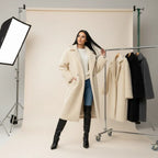 women's long oversized coat shown in cream wool with relaxed fit and boots creating a refined neutral winter outfit look