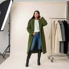 women's long oversized coat styled in green wool studio look with knee high boots offering warm elegant winter layering