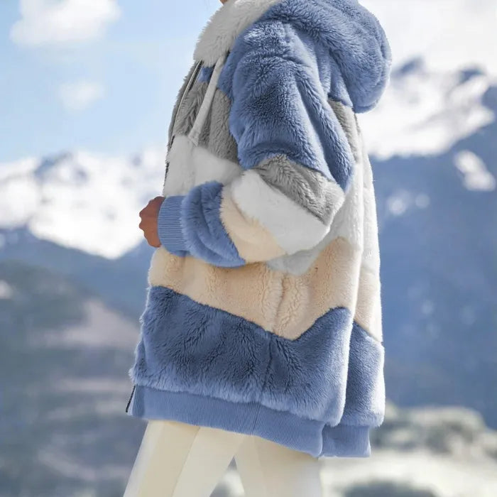 Womens loose plush jacket with blue and neutral striped design.