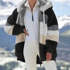 Womens loose plush winter jacket with hood and striped fur pattern.