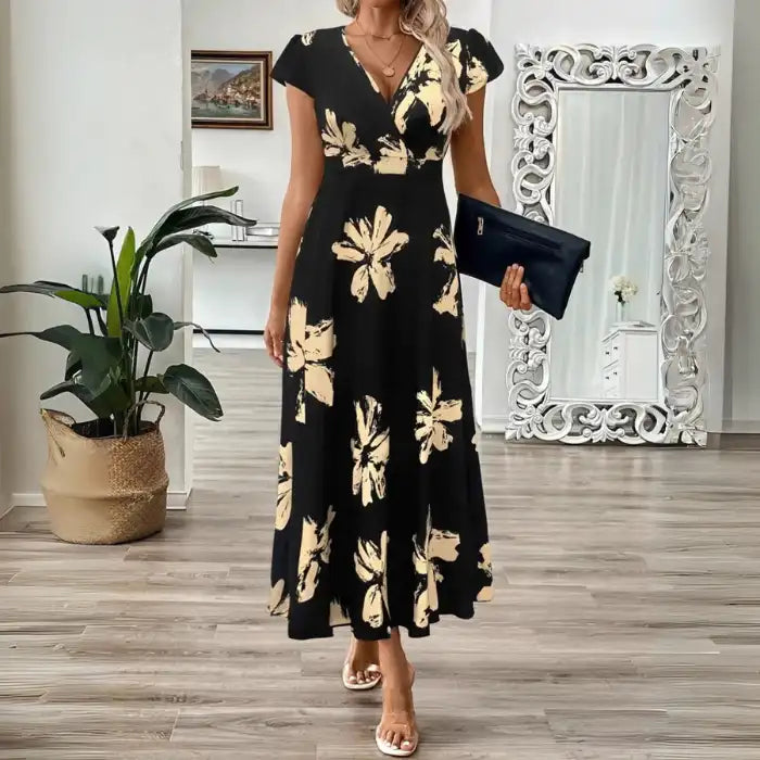 Women's midi dress with v-neck and beige floral accents styled for an elegant evening or casual event.