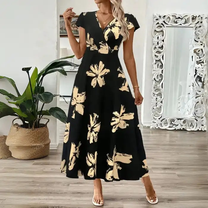 Women's midi dress with beige floral print, short sleeves, and v-neckline in a flattering fit and flare cut.