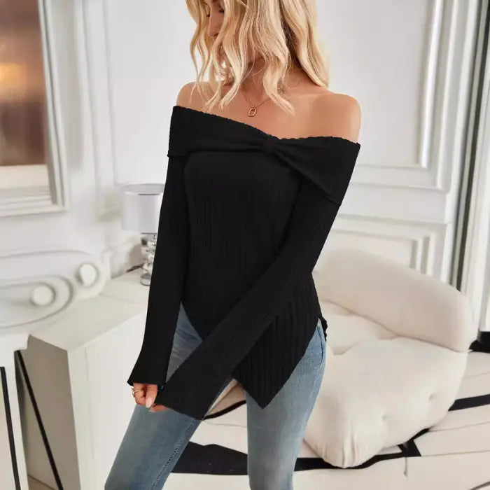 Isolated image of women's off shoulder knit top in black with knot detail neckline.