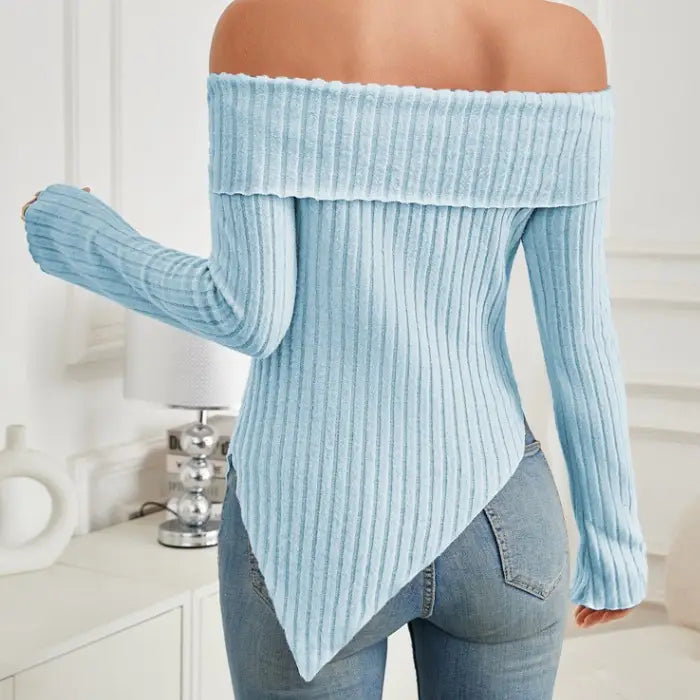 Back close-up of light blue women's off shoulder knit top showing ribbed texture and pointed hem.