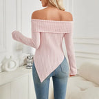Back view of women's off shoulder knit top in soft pink with ribbed texture and pointed hem.