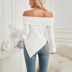 Back view of women's white off shoulder knit top showing ribbed knit and asymmetrical hemline.
