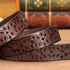 women's patterned belt in brown leather with intricate floral cutout detailing