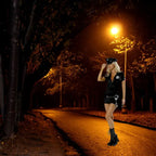 Women's police officer costume styled in a dimly lit park with trees and glowing lampposts.