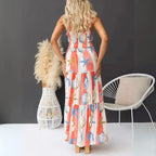 Women's printed spaghetti strap maxi dress with smocked back and bold coastal print.