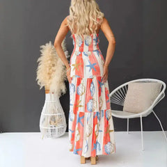 Women's printed spaghetti strap maxi dress with smocked back and bold coastal print.
