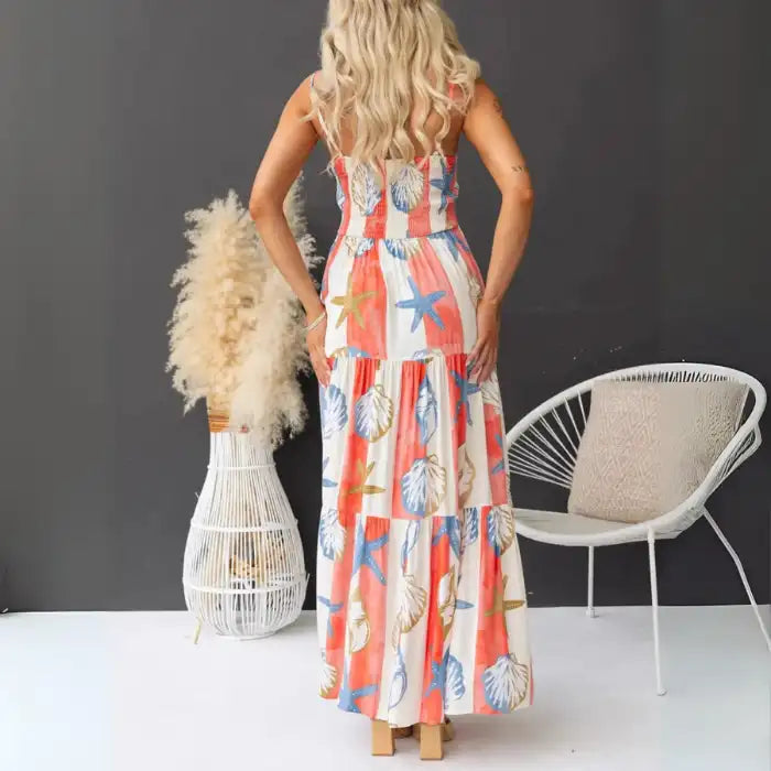 Women's printed spaghetti strap maxi dress with smocked back and bold coastal print.