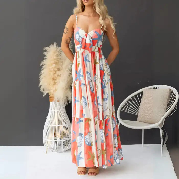 Women's printed spaghetti strap maxi dress with pockets featuring shell and starfish design and front tie.