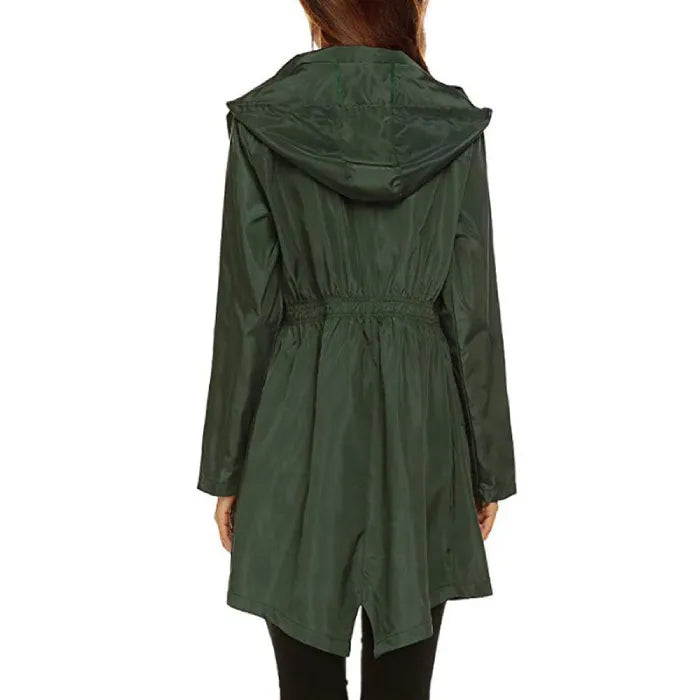 Womens raincoat in dark green shown from the back with hood and cinched waist.