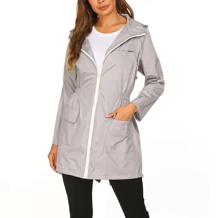 Womens raincoat in gray featuring pockets and full front zipper.