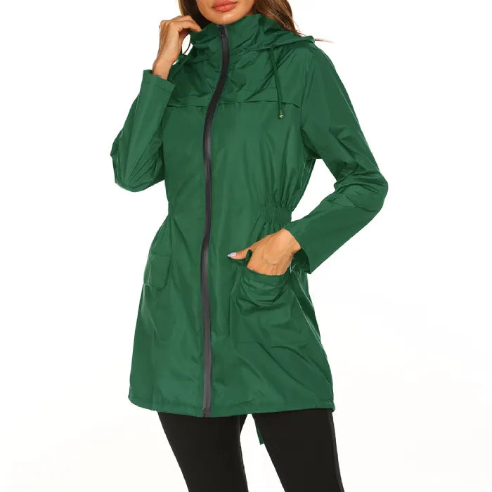 Womens raincoat in green with cinched waist and front pockets.