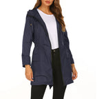 Womens raincoat in navy blue with front zipper and pockets.