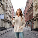 Women's Ribbed Hoodie styled for a casual coffee run on a cobblestone street in the city.