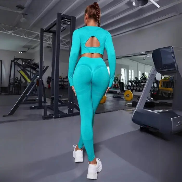  Women's seamless butt-lifting sportswear sets in aqua blue, full-length set with gym-ready features.