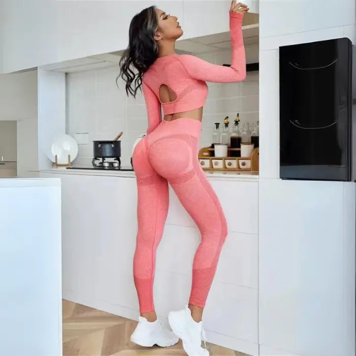  Women's seamless butt-lifting sportswear sets in coral red shade, breathable and body-sculpting style.