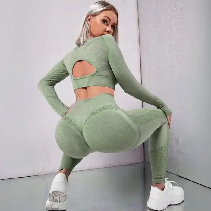  Women's seamless butt-lifting sportswear sets in light green, textured high-rise leggings and long-sleeve top.