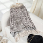 womens shawl in soft cream leopard pattern with fringe detail, designed for cozy layering and timeless appeal
