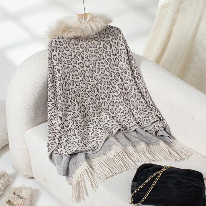womens shawl in soft cream leopard pattern with fringe detail, designed for cozy layering and timeless appeal