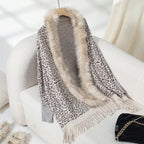 womens shawl with leopard print and faux fur trim, finished with fringe edges for a cozy and stylish winter look