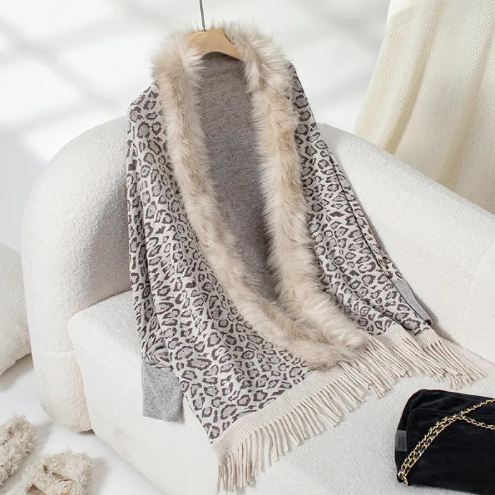 womens shawl with leopard print and faux fur trim, finished with fringe edges for a cozy and stylish winter look