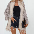 womens shawl featuring leopard pattern and fringe hem, worn casually for stylish layering and everyday comfort