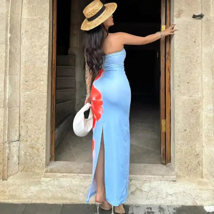 Women's summer slit dress rear view showing side slit and red floral design