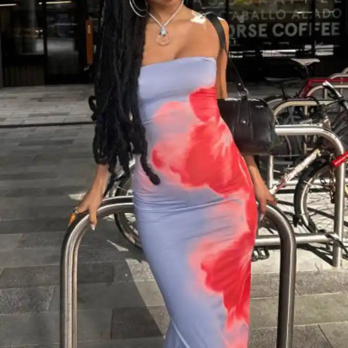 Strapless summer slit dress styled casually with red floral print in city setting