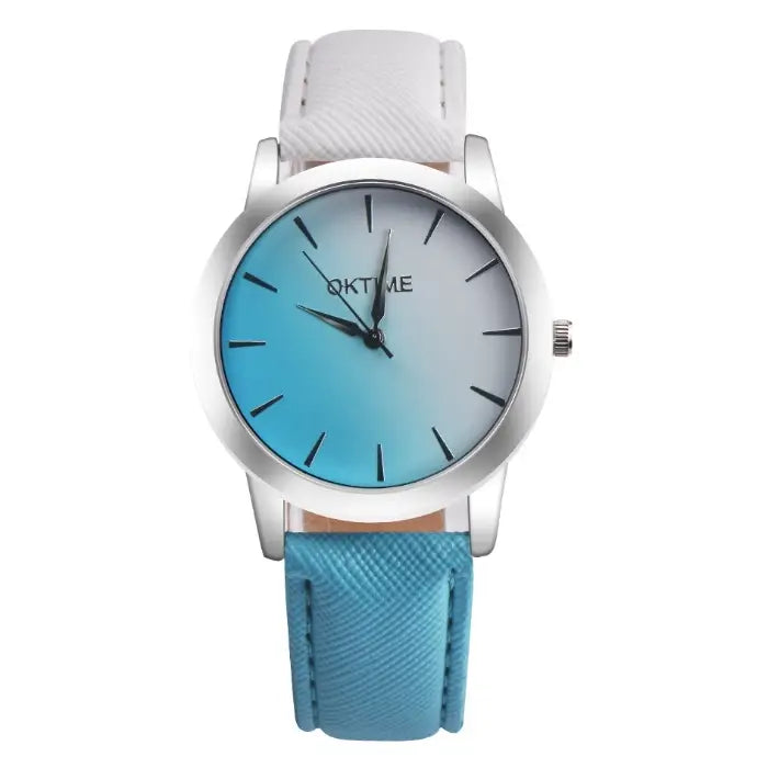 Contemporary women's watch with turquoise gradient face, silver case, and white textured leather band